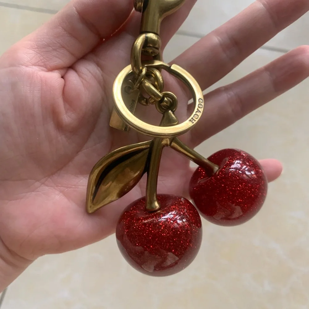 Coach Gold-Tone Keychain with Red Glitter Cherry Charm